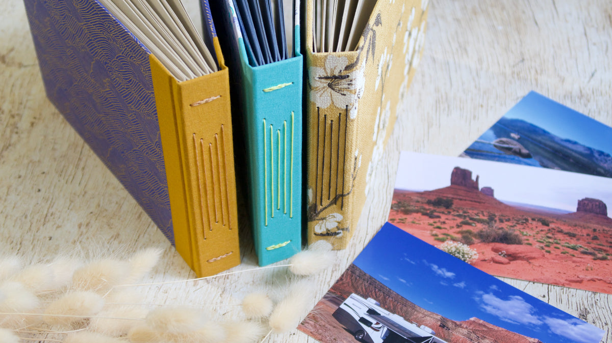 Personnalisez votre album photos en choisissant la couverture, le fil de reliure et la couleur des pages